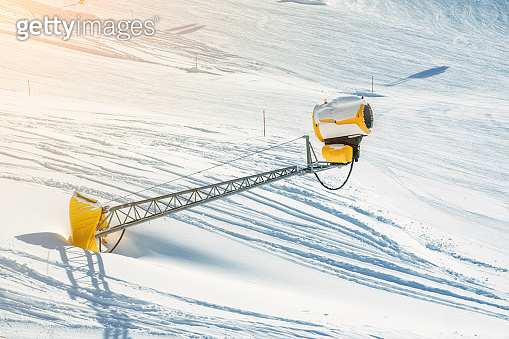 Ski lift ropeway on hilghland alpine mountain winter resort on bright ...