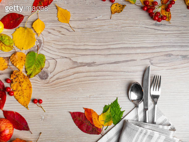 Fall Table Setting Background Thanksgiving table setting cutlery on the autumn background with autumn ...