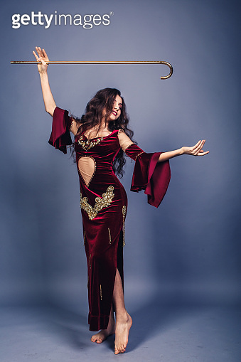 beautiful young girl dancing with a cane belly dance saidi. 이미지