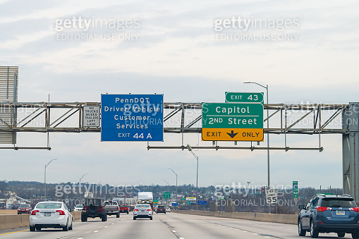 Exit sign on highway 83 north in Pennsylvania with cars traffic on ...