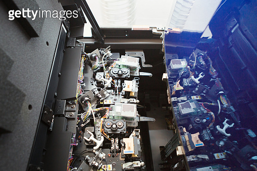inside of a digital printer. the interior of a complex machine ...