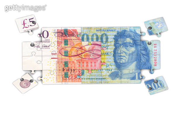 pound-and-forint-jigsaw-pieces-1190882976