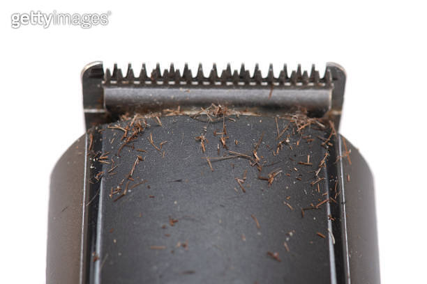 Dirty electric shaver Machine with Hair and Stubble on top - isolated ...