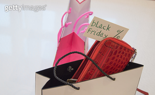 Online shopping concept with smartphone and credit Bank cards, black