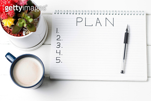 Inscription Plan in notepad, close-up, top view, concept of planning ...