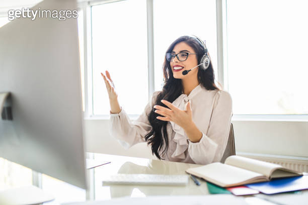 Smart Professor Female smart professor wearing headset and holding online class for e ...