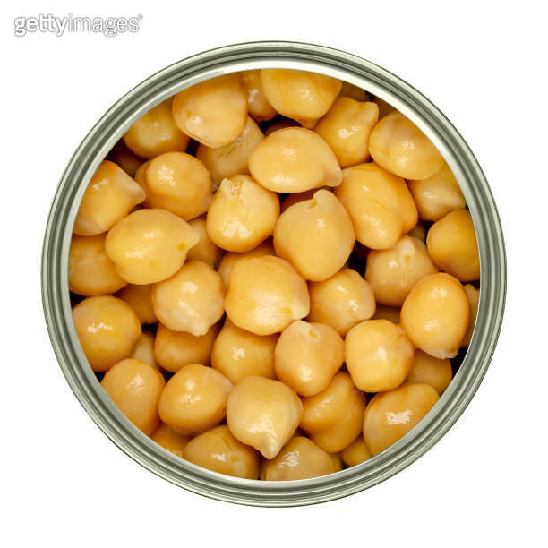Canned chickpeas, large light tan chick peas in a can from above 이미지