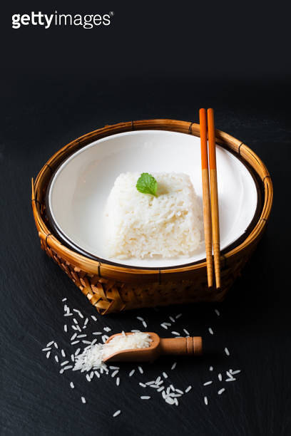 Slate Rice Asian Food concept cooked Thail jasmine rice long grain rice in ceramic ...