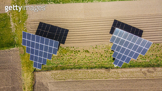 Sub V Solar Farm solar sub station. Rotating solar panels at the rural area. Small ...