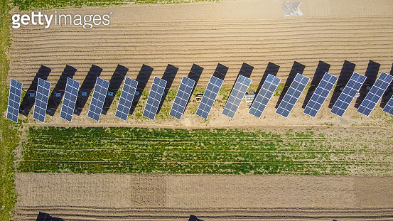 Sub V Solar Farm solar sub station. Rotating solar panels at the rural area. Small ...