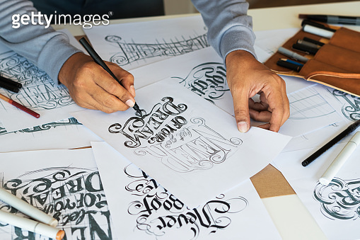 Typography Calligraphy artist designer drawing sketch writes letting ...