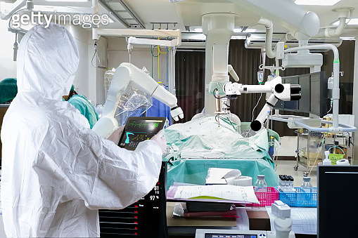 Doctor Controls The doctor controls the medical robot to treat patients. (1219176880 ...