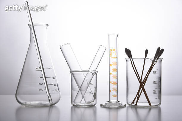 Glass Container Science Group of scientific laboratory glassware with clear liquid solution ...