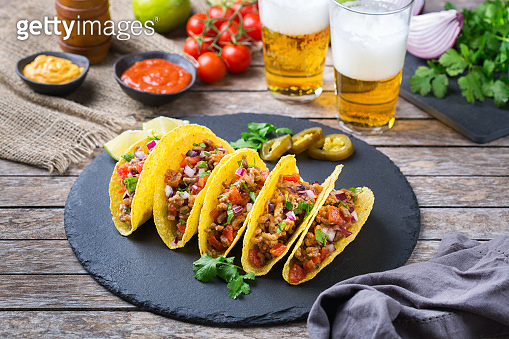 Taco shell nachos with beef, guacamole, chili, cheese salsa, tequila ...