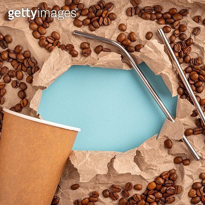 Recycled paper Cup with metal straw on blue paper background and ...