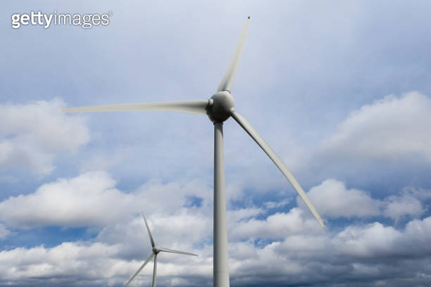 two wind wheels in front a cloudscape 이미지 (1206920601) - 게티이미지뱅크