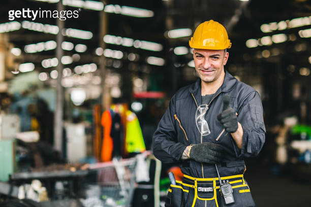 Portrait of foreman labor worker engineer working in industrial factory ...