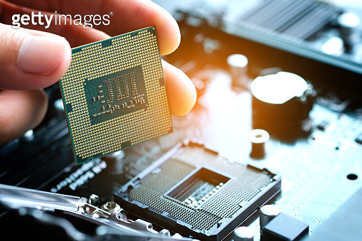 Getty Images Computer Processing Hand of computer engineering brings computer cpu processor memory ...