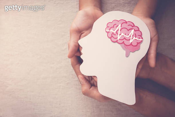 Adult and child hands holding encephalography brain paper cutout ...