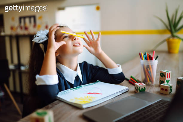 Funny little girl playing at distance learning lessons. 이미지 (1270745034 ...