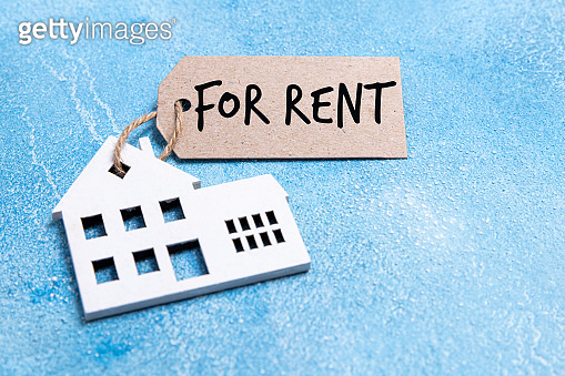 House for rent label. Wooden house symbol with rent tag on blue ...
