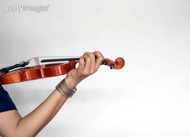 Human hand holding violin and put finger press on string,show how to ...