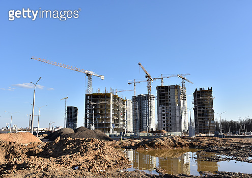 Tower crane constructing a new residential building at a construction ...