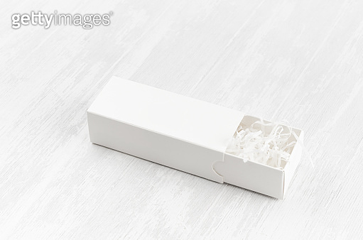 White blank open rectangle box with filler mock up on wood board side ...