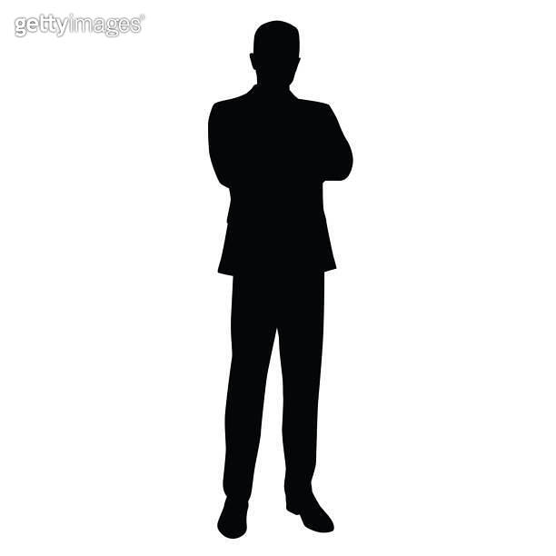 Business man in a business suit stands with his arms crossed, front
