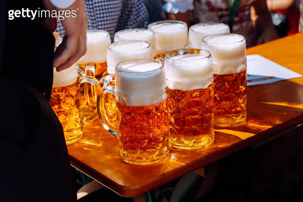 Table With Beer Glasses At Oktoberfest Munich Germany 1207477036 table-with-beer-glasses-at-oktoberfest-munich-germany-1207477036