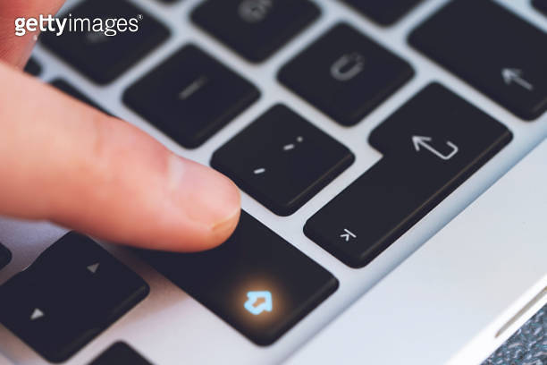 Touching Key Task Closeup of Man's Finger Touching the Letter Shift Key button on Black ...