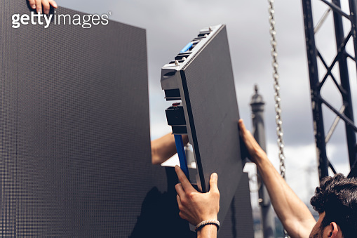 Setup phase a LED LCD wall or stage panel. Display system for concerts ...