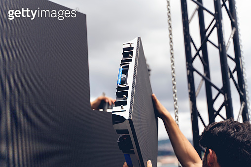 Setup phase a LED LCD wall or stage panel. Display system for concerts ...
