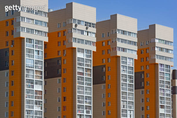 New multi-storey buildings in a row. Concept of housing construction ...