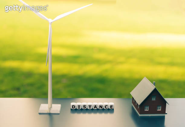 Symbol for minimum distance between wind turbines and residential areas ...