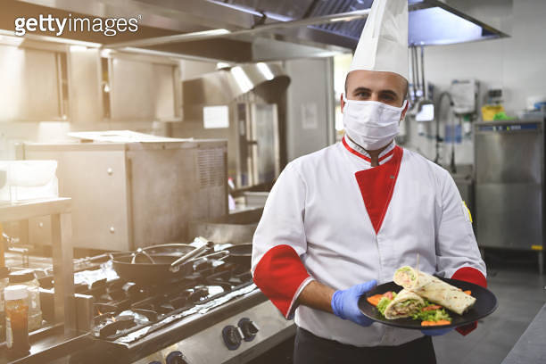 chef cook wearing face protective medical mask for protection from ...