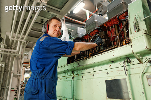 Marine engineer officer controlling vessel enginesand propulsion in ...