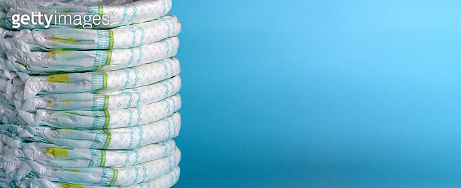 Stack of diapers. Banner. Blue background 이미지 (1214419269) - 게티이미지뱅크