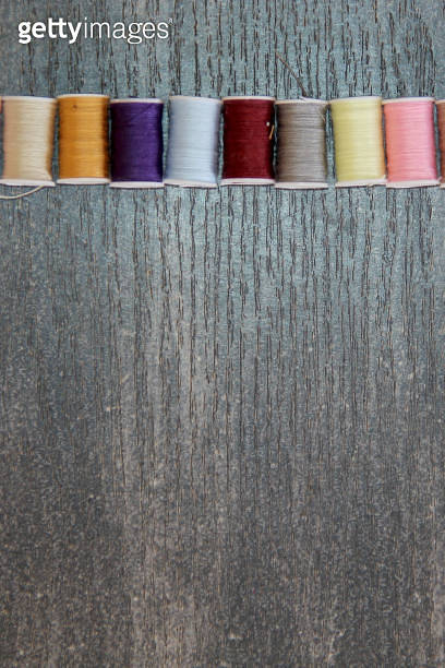 set of spools of colored threads for sewing and fashion design on