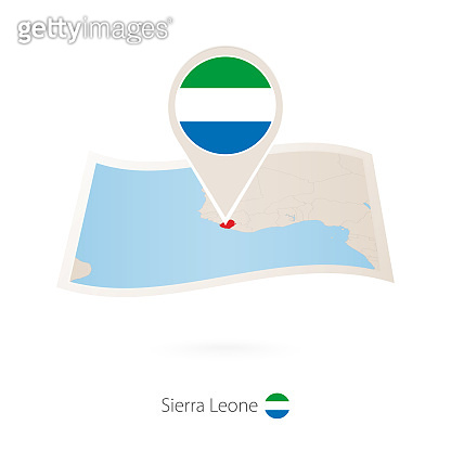 Folded paper map of Sierra Leone with flag pin of Sierra Leone. 이미지 ...