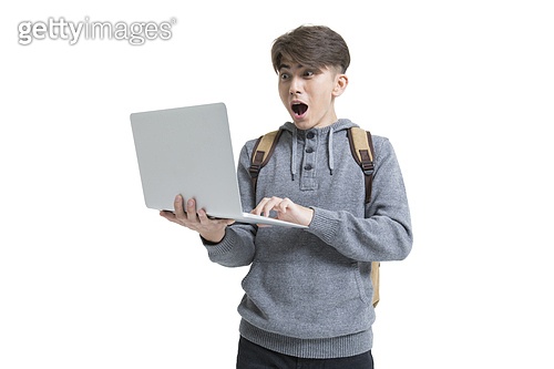 Shocked male college student using laptop 이미지 (a11362149) - 게티이미지뱅크