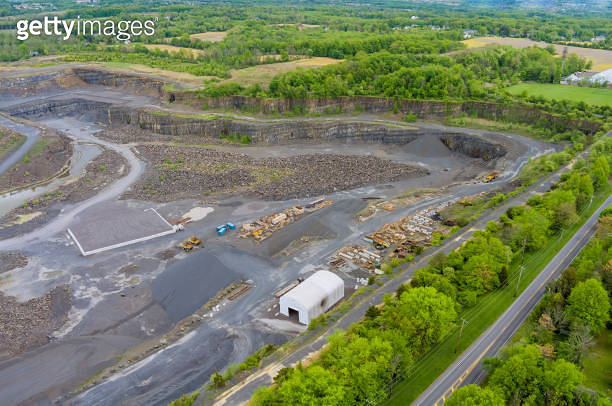 Large, open-pit mine showing the industrial exterior, ore mining quarry ...