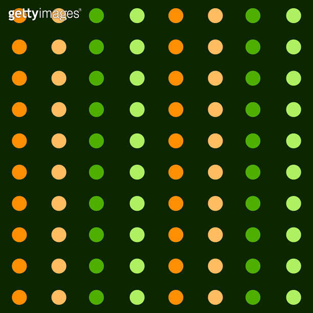 A pattern of green and orange dots in vertical lines on a green ...