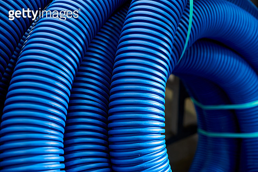 Skeins of blue corrugated pipe close up 이미지 (1334127674) - 게티이미지뱅크