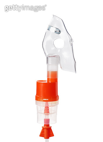 Atomizing cup with respiratory mask for nebulizer isolated on white ...