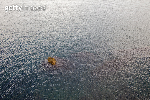Stranded Between Two Rocks Stranded with rocks on the coastal sea 이미지 (1338874732) - 게티이미지뱅크