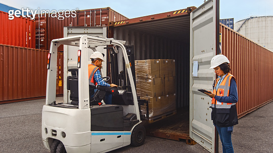 Container Store Driver Forklift Driver Loading a Shipping Cargo Container with a Full Pallet ...