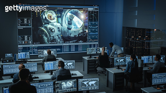 Group of People in Mission Control Center Establish Successful Video ...