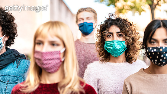 Urban crowd of citizens walking on city street covered by face mask ...