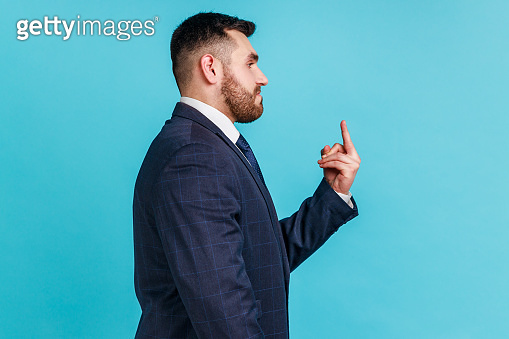 Profile portrait of bearded aggressive hater, angry man wearing ...
